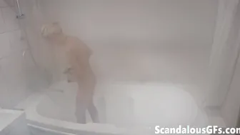 My nude teen in the bathtub relishing a long steam shower
