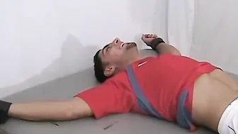 Ticklish and sexy soccer player is bound on the table