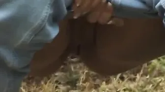 Dame peeing outdoors