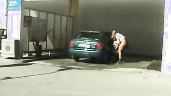 Gal peeing in car washing