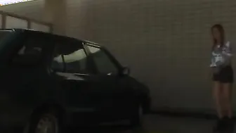 Gal peeing in car washing