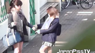 Japanese babe and her friend piss together out in public
