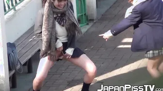Japanese babe and her friend piss together out in public