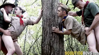 Scouts Marcus and Troye kneels for Scout Leaders dicks