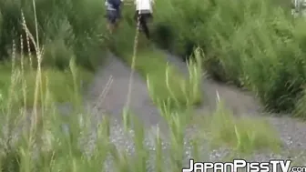 Schoolgirls from Japan peeing while taking a hike