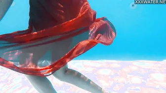 Russian babe swims naked in the pool