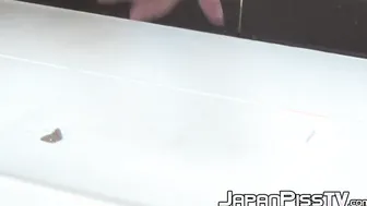 Pretty Japanese babe with hairy pussy pissing hard
