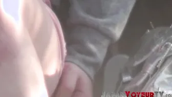 Young Japanese babe filmed toying pussy at a bus stop