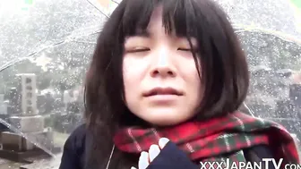 Cute Japanese chick has vibrator pleasing her in the rain