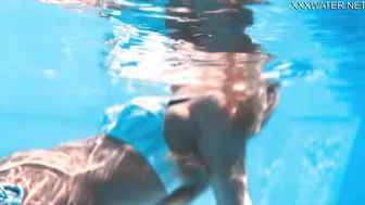 Cinematic beauty swims and strips showing her tight pussy