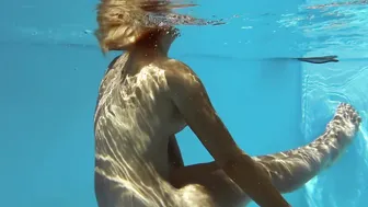 Small tits blonde babe Sofie Otis swimming naked