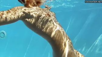 Small tits blonde babe Sofie Otis swimming naked