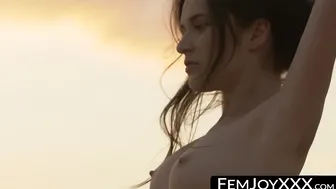 On the beach sexy beauty exposes her bare body