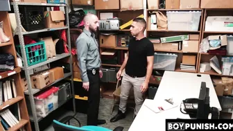 A security guard kicks a young Latino shoplifter in the ass