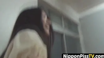 Japanese minx has shaggy pussy peeing in lobby