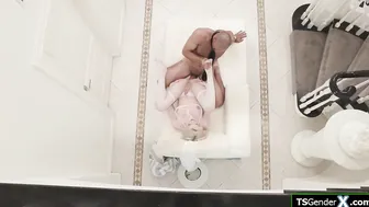 Trans Izzy Wilde on her back barebacked