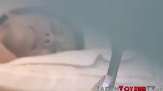 Brown cutie spreads her legs and fills her Japanese pussy