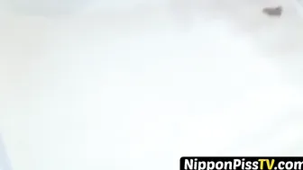 Japanese angel with bushy pussy pissing hard