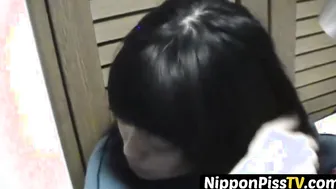 Delightful Japanese chick sits on the latrine and pees in a cup