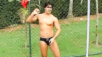 Horny Brazilian jock jerking off his throbbing cock outdoors