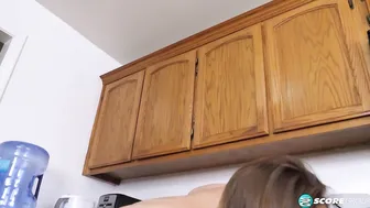 College student Avery smiles as she spreads her hairless cunt in the kitchen.