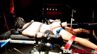 Chained jock lying face down being fisted in his ass