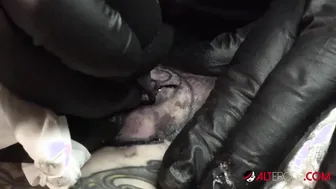 Marie Bossette getting a painful tattoo on her leg