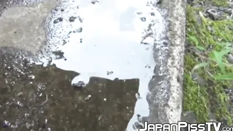 Tantalizing Japanese girl peeing in front of someone bicycle