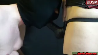 Strap-on dildo blown by slaves