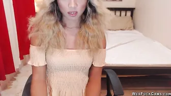 Blonde shemale wanks off in chair in front of webcam