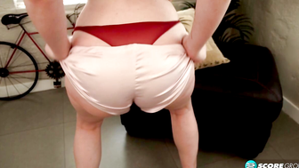 An all-natural E-cup redhead shows off her curvy body and spreads her hairy pussy.