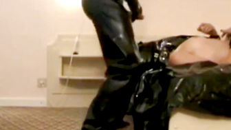 Leather BDSM. Sub Milena fucked in Throat