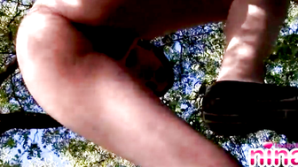 Lesbian Nina showcasing her natural tits and ass in forest