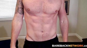 The muscular Logan Carter displays his abs and jerks himself off in front of the came