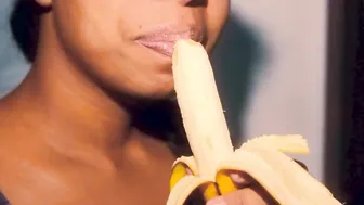 Sexual black with babe lips having fun with a banana