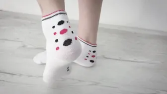 Preparing Bae Toes for Devils Pedicure inside White Socks and Shirt