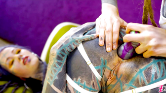 Tattooed hotties fuck each other with crazy toys