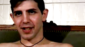 Slim twink tugs on his throbbing dick in this classic video