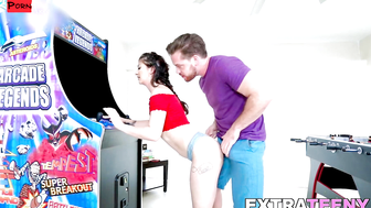 Naughty teen plays arcades while getting nailed from behind