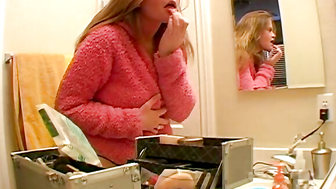 Busty blonde camgirl in the bathroom