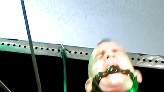 Bigg Pete struggles to get off the chains bound to his body down to his balls