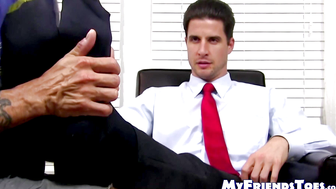 Hunky guy in a suit has his feet and toes licked sensually