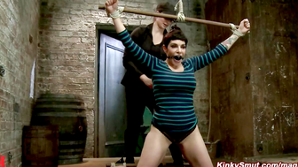 Annika bound in kneeling spread eagle