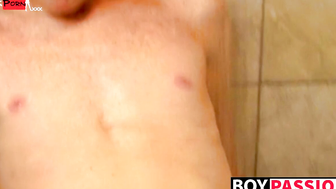 Redhead twink Alan Parish masturbates and cums under shower