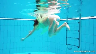 Bushy teenie Goddess Nina Mohnatka swims into the pool