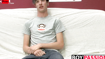 Adorable gay guy Danny jerks off his dick on couch solo
