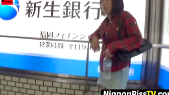 NipponPissTV.com - Amateur Oriental businesswoman caught pissing by voyeur in public