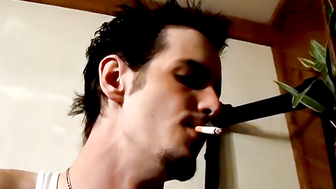 Straight rocker Axel plays his guitar and his throbbing cock with his pack of cigaret