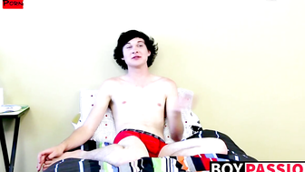 Twink tugs on his massive cock and uses dildo on his ass