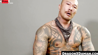Buffed Damian Dragon stuffs his ass with a dildo while jerking himself
